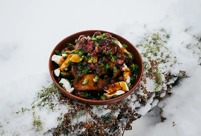 Poutine with wild duck breast, brussel sprouts, mushrooms, bacon and maple syrup pepper sauce.